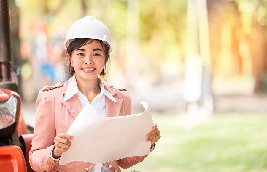 executive Asian engineer woman checking construction site business environment engineer concept