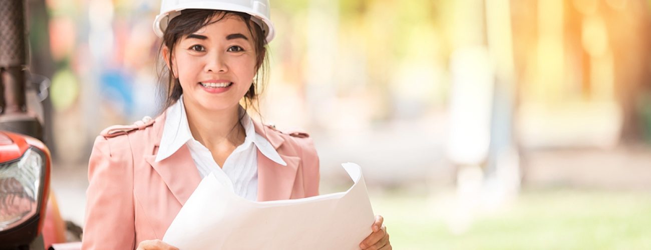 executive Asian engineer woman checking construction site business environment engineer concept